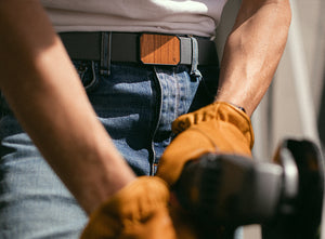 man working with a tool while wearing the groove belt
